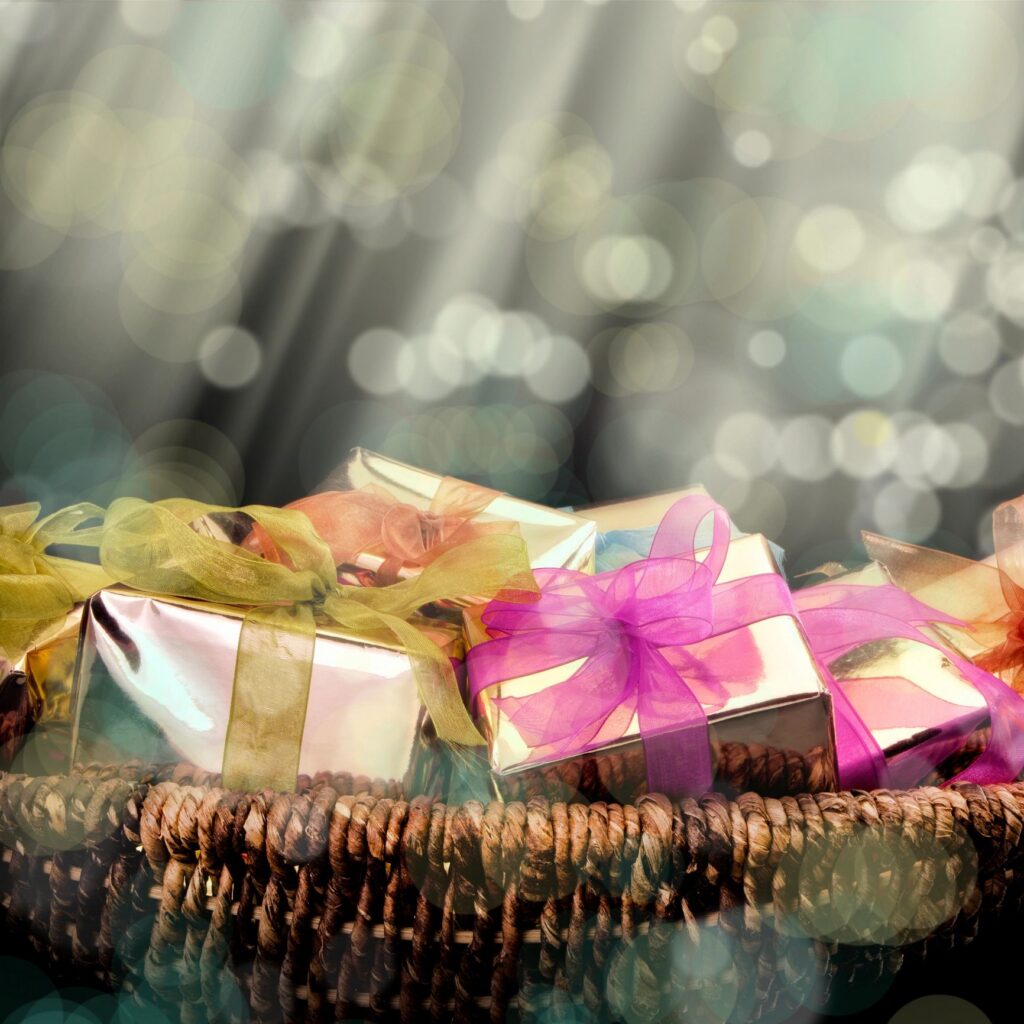 Pile of colorful gift box arrangement in basket